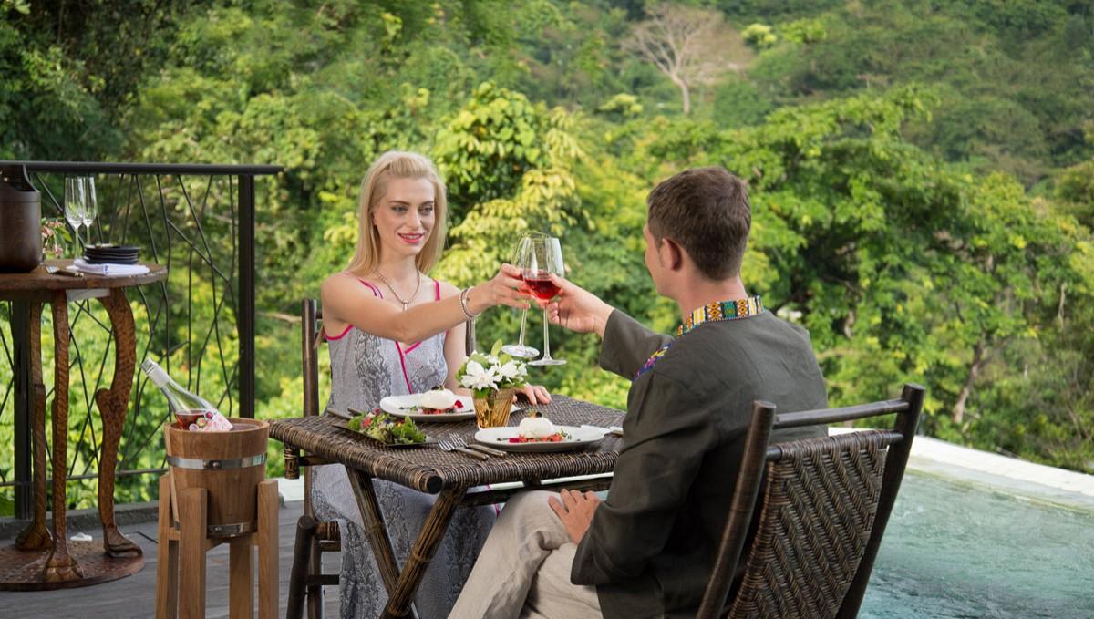 Hotel Keemala Kamala Beach Esterno foto A couple toasting with wine