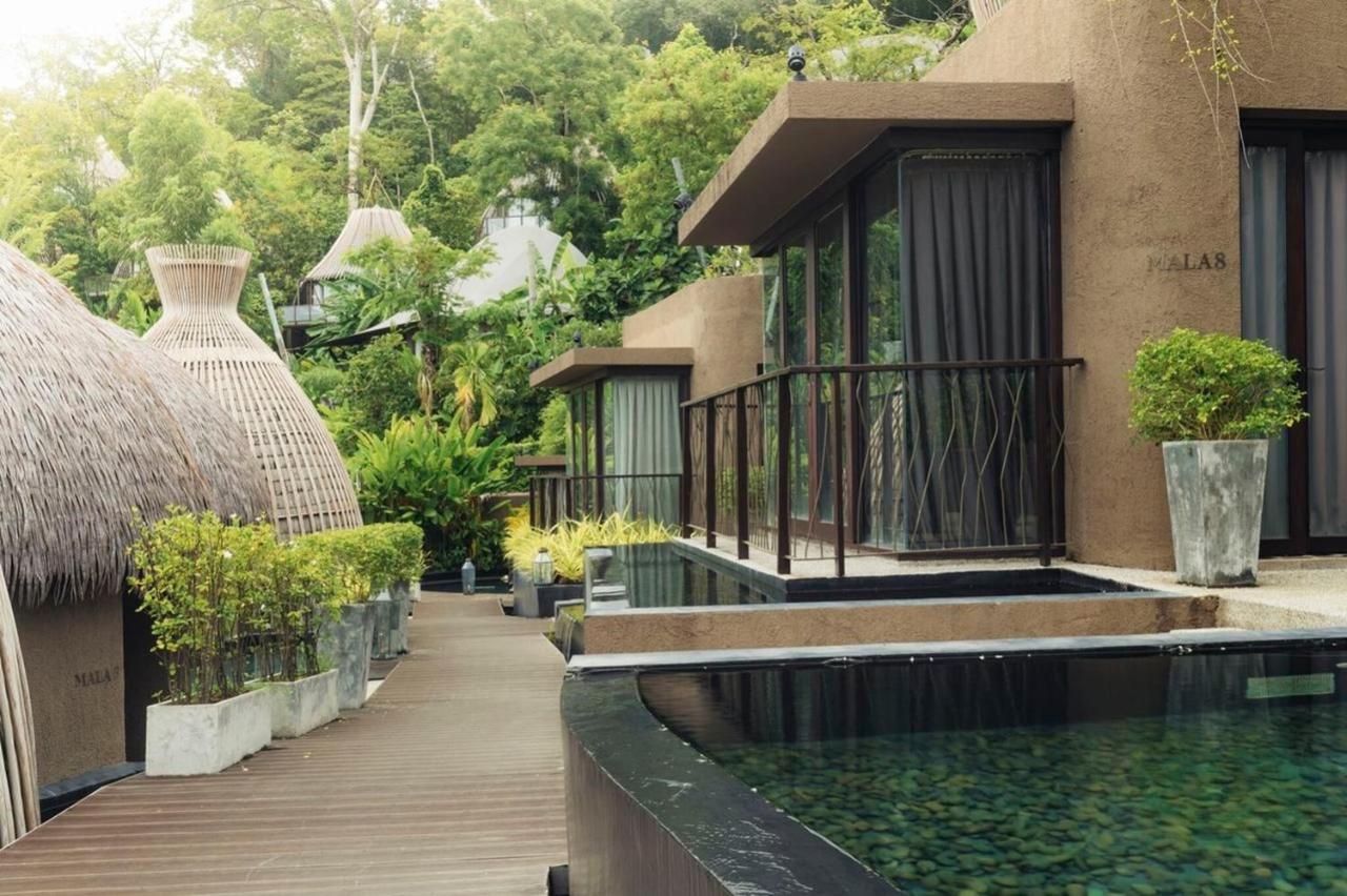 Hotel Keemala Kamala Beach Esterno foto The resort's villas